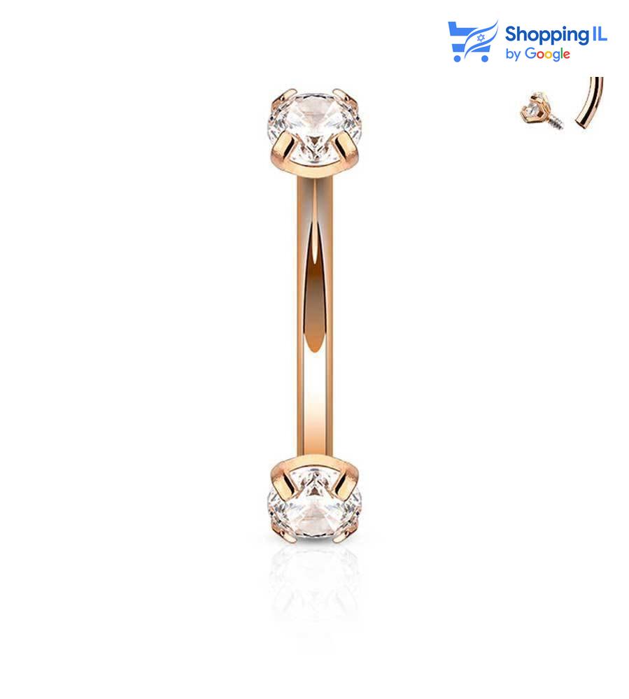 עגיל רז מצופה זהב רוז - עגיל בננה עשוי מתכת רפואית מצופה זהב רוז, ובעלת הברגה פנימית. העגיל בעיצוב עגיל בננה משובץ שני אבני זירקון בסוגרים. מצופה - זהב רוז מידה - מגיע בעובי של 1.2 מ"מ ובאורך 8 מ"מ קוטר סוגרים -3 מ"מ  העגיל מיועד בעיקר לאזורים הבאים: - פירסינג בגבה - פירסינג רוק - פירסינג בטבור (קצר ודק במידה מהסטנדרט) - כמובן שניתן לענוד את העגיל גם באזורים אחרים (: