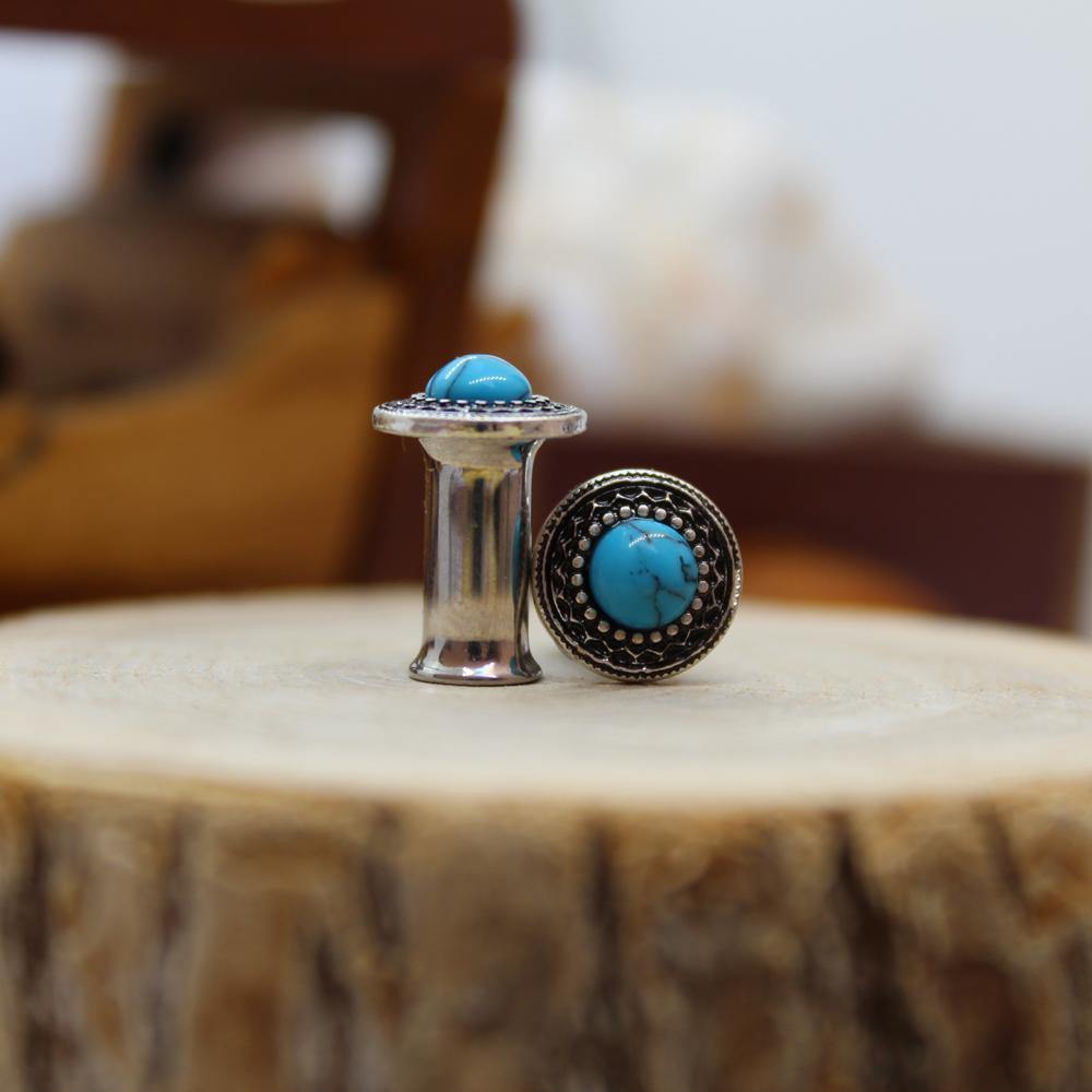 הרחבת Atlas Plug - עשויה מתכת רפואית. הרחבת פלאג פלייר בעיצוב מגן משובץ אבן טורקיז. צבע - טורקיז מידה - מגיע בקוטר 10 מ"מ
