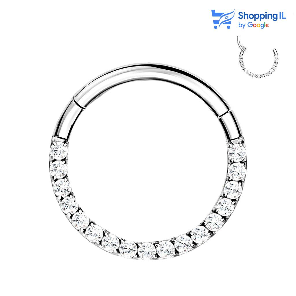 חישוק לאקי- עגיל קליקר עשוי טיטניום. עגיל קליקר עשוי טיטניום בעיצוב חישוק משובץ בסט אבני זירקון, מהפנטים. צבע - כסף מידה - מגיע בעובי 1.2 מ"מ ובקוטר 8  העגיל מיועד בעיקר לאזורים הבאים: - פירסינג הליקס - פירסינג טראגוס - פירסינג ספטום - פירסינג קונץ'  - כמובן שניתן לענוד את העגיל גם באזורים אחרים (: